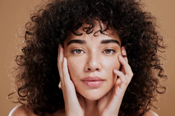 woman-hands-on-face-and-afro-hair-care-for-beauty-2022-12-22-19-53-32-utc