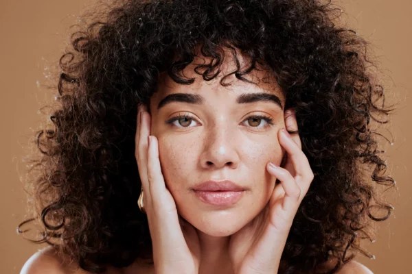 woman-hands-on-face-and-afro-hair-care-for-beauty-2022-12-22-19-53-32-utc woman-hands-on-face-and-afro-hair-care-for-beauty-2022-12-22-19-53-32-utc